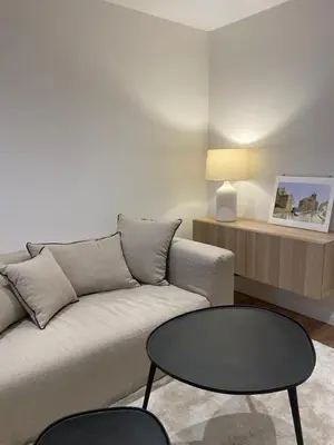 a living room with a couch and a table at Terraza as Travesas in Betanzos