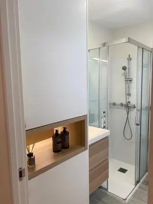 a bathroom with a shower with a glass door at Terraza as Travesas in Betanzos