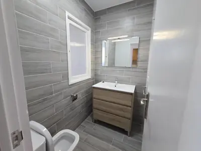 a bathroom with a sink and a mirror at CASA DAVID-con cuadras para caballos in Arzúa