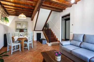 a living room with a couch and a table at Casa do Cesteiro in Santiago de Compostela