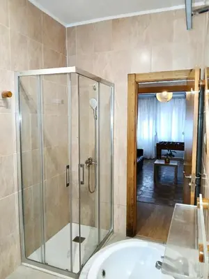 a bathroom with a shower and a tub at Segundo Antolín Yellow Door in Ponferrada