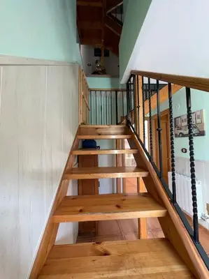 a set of wooden stairs in a house at Villaduranchi in Villablino