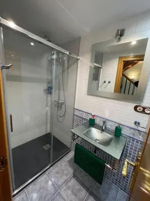 a bathroom with a shower and a sink at Villaduranchi in Villablino