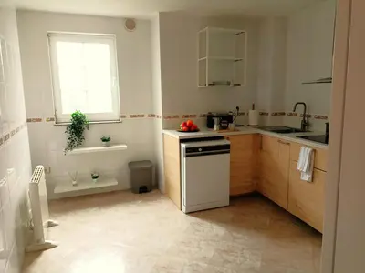 a small kitchen with a sink and a dishwasher at O Soño de Santiago - Casa rural Mondoñedo, Galicia in Mondoñedo