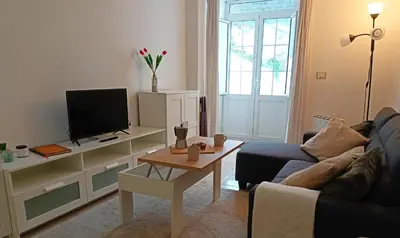 a living room with a couch and a tv at O Soño de Santiago - Casa rural Mondoñedo, Galicia in Mondoñedo