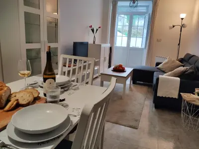 a living room with a table and a couch at O Soño de Santiago - Casa rural Mondoñedo, Galicia in Mondoñedo