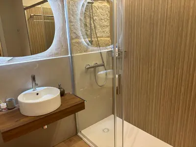 a bathroom with a sink and a shower at LAS TERRAZAS II Apartamento de lujo frente a la Catedral in Ourense