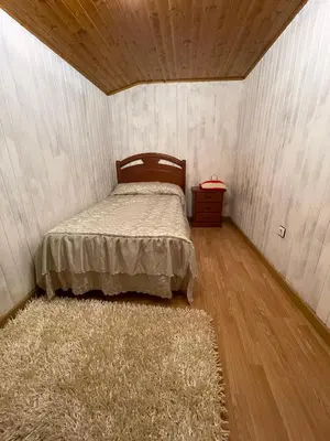a small bedroom with a bed and a rug at CASA GUIMARAS in Cortes
