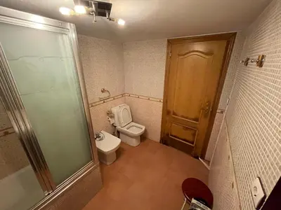 a small bathroom with a toilet and a shower at CASA GUIMARAS in Cortes