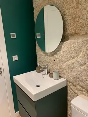 a bathroom with a sink and a mirror at LAS TERRAZAS I Lujo frente a la plaza de Santa Eufemia in Ourense