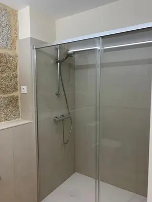 a shower with a glass door in a bathroom at LAS TERRAZAS I Lujo frente a la plaza de Santa Eufemia in Ourense