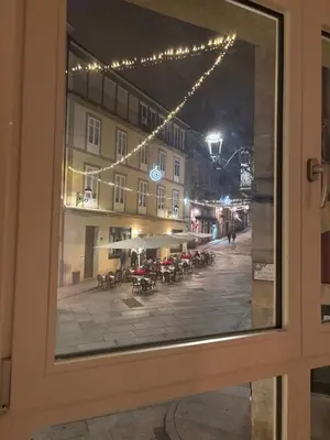 a view from a window of a street at night at LAS TERRAZAS I Lujo frente a la plaza de Santa Eufemia in Ourense