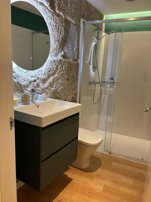 a bathroom with a sink and a shower at LAS TERRAZAS I Lujo frente a la plaza de Santa Eufemia in Ourense