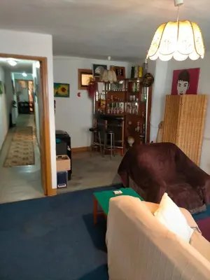 a living room with a couch and a table at Apartamento Casco Viejo in Ourense