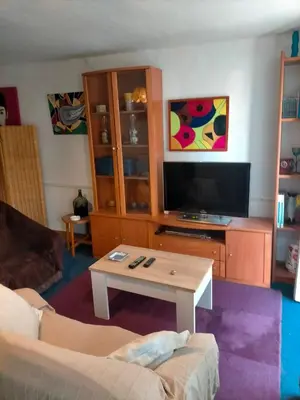 a living room with a couch and a coffee table at Apartamento Casco Viejo in Ourense