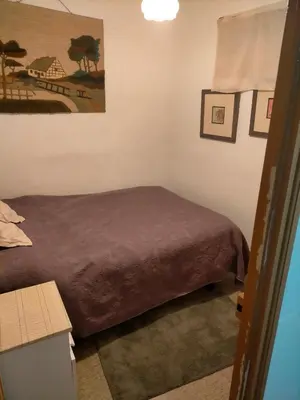 a bedroom with a bed and a picture on the wall at Apartamento Casco Viejo in Ourense