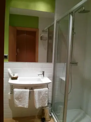 a bathroom with a sink and a shower at NRuta Ponferrada in Bembibre