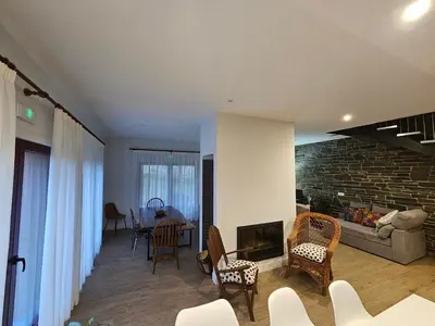 a living room with a couch and a fireplace at La Cochorla in Páramo del Sil