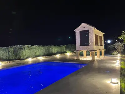 a swimming pool in a yard at night at Casa Eudosia, Tenorio in Barro