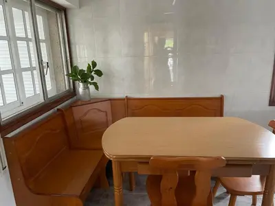 a wooden table with a potted plant sitting next to a window at Casa Eudosia, Tenorio in Barro