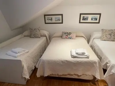 a room with two twin beds with towels on them at Casa Eudosia, Tenorio in Barro