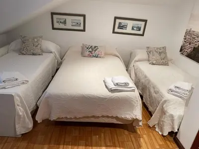 a room with two twin beds with white sheets at Casa Eudosia, Tenorio in Barro