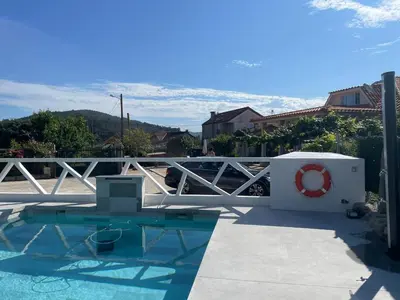 a swimming pool with a red life preserver on a fence at Casa Eudosia, Tenorio in Barro