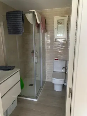 a bathroom with a shower and a toilet at DUNAS DE LLAS in Foz