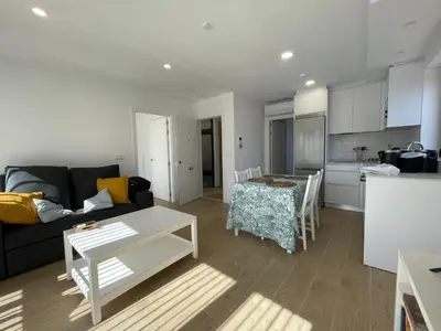 a living room with a couch and a table at Apartamentos Ares Rentals in Ares