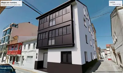 a black and white building on a city street at Apartamentos Ares Rentals in Ares