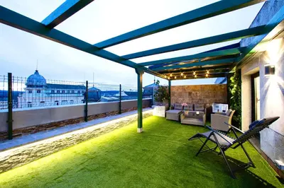 a patio with a view of the ocean on a building at Lucus Skyline & Terrace by Lugo Collection in Lugo