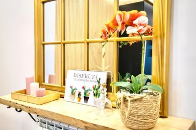 a window with a book on a table with flowers at Lucus Skyline & Terrace by Lugo Collection in Lugo