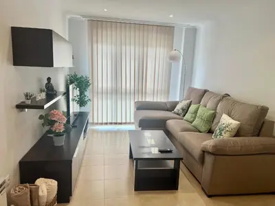 a living room with a couch and a coffee table at PARAISO in Viveiro