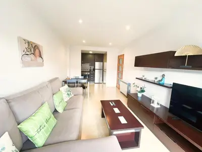 a living room with a couch and a television at PARAISO in Viveiro