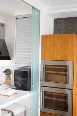 a kitchen with a microwave oven and a counter at Ático en el camino de Santiago in Sarria