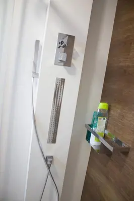 a bathroom with a shower with a shower head at Ático en el camino de Santiago in Sarria
