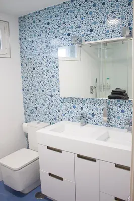 a bathroom with a white sink and a toilet at Ático en el camino de Santiago in Sarria