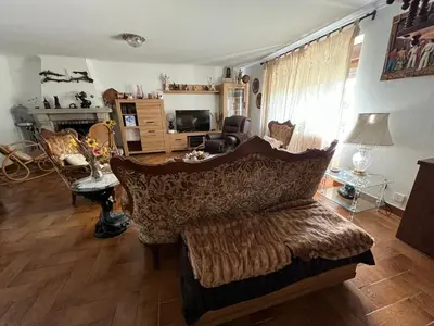 a living room with a couch and a table at Casa Camiño do Eume in A Coruña