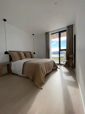 a bedroom with a large bed and a large window at APARTAMENTO A ESTRENAR en FOZ COFRADIA DELUXE in Foz