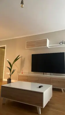 a living room with a flat screen tv on a wall at Apartamento Santiago in Santiago de Compostela