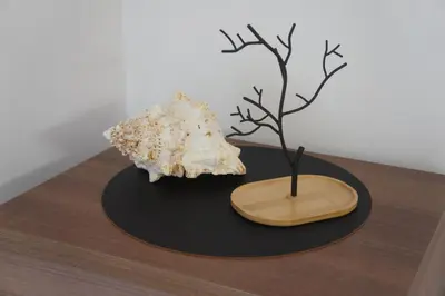 a sculpture of a tree and a shell on a table at Alojamientos Viveiro - Playa de Covas I in Viveiro