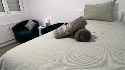 a bedroom with a bed with a stuffed animal on it at Piso Camino de Santiago in Sarria
