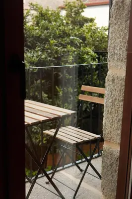 a room with a glass door and a shelf at Villa Julia in Ribadavia