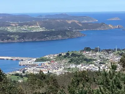 a town on a hill with a body of water at Rego de Flores in Viveiro