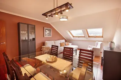 a living room with a glass table and chairs at Rego de Flores in Viveiro