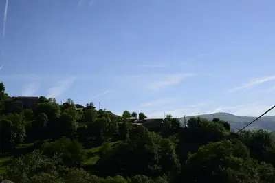 a view of a hill with trees and a blue sky at Casa Gloria in Moncó