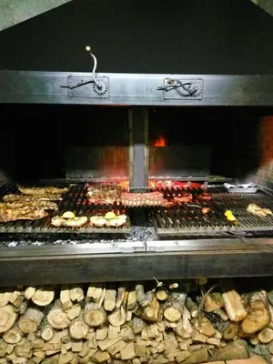 a grill with many different types of food in it at Hotel Parrilla el Zangano in Boal
