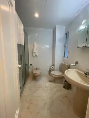 a bathroom with two toilets and a shower and a sink at SOL Y MAR in Vivero