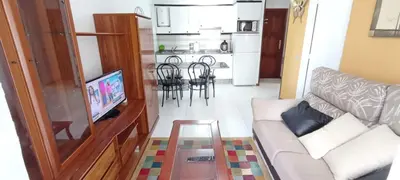 a living room with a couch and a table at EnFOZ SuperAlojamiento Entre Playas in Foz