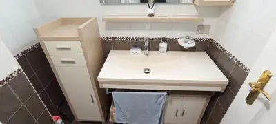 a small bathroom with a sink and a cabinet at EnFOZ SuperAlojamiento Entre Playas in Foz